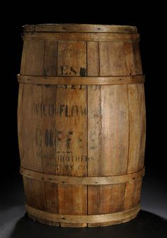 an old wooden barrel with writing on it