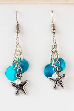 pair of starfish and seashell earrings with blue glass beads on silver plated hooks