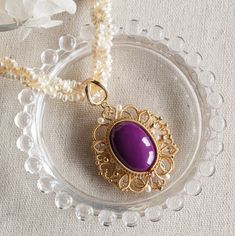 "This beautiful pendant necklace is made from a large oval Phosphosiderite (pink rock), white Cubic Zirconia and Pearl on beaded necklace. The main stone - Phosphosiderite, it exhibits a purple to reddish violet colour. It is beautiful and unusual stone. The stone is carefully hand wired with white Cubic in 14K gold filled. The beaded necklace is an amazing piece as well. It is made from three strands of beaded Pearl and braided together. The necklace finished with lobster clasp and extension. T Exquisite Oval Necklace With Large Pendant, Oval Gemstone Pearl Necklace Gift, Violet Colour, Beautiful Pendant Necklace, Lilac Color, Wedding Jewellery Necklace, Wedding Necklace, Lobster Clasp, Unique Pieces