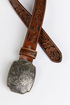 Genuine leather Floral tooled strap Silver floral etched buckle 1.5" wide Tan overlay with black underlay Faster Horses Festival, Women Belt, Leather Floral, Fragrance Gift, Fragrance Gift Set, Cold Weather Accessories, Boots For Sale, Denim Outfit, Boot Shop