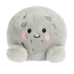 a white stuffed animal with pink eyes and ears