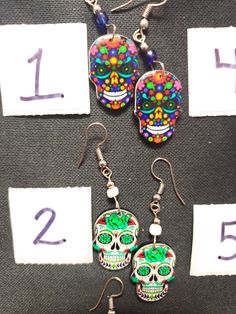 HANDMADE SUGAR SUGAR EARRINGS set 4 --choose from #1-9 and that exact one you will receive :) If you would like many please message us :) DETAIL IS AMAZING! NOT ONE IS THE SAME! COOLER IN PERSON! Set 4 Bohemian Skull Earrings For Gifts, Nickel Free Skull Jewelry For Day Of The Dead, Nickel-free Skull Jewelry For Day Of The Dead, Halloween Skull Jewelry With Skull Print, Skull Shaped Jewelry For Day Of The Dead Party, Skull Jewelry For Day Of The Dead Party, Multicolor Halloween Earrings For Gift, Multicolor Halloween Earrings Gift, Day Of The Dead Skull Jewelry Gift