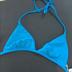 Super Cute, Great Quality Nwt Blue - Teal Colored Bikini Top. Size Medium Fitted Blue Swimwear With Built-in Bra, Blue Swimwear With Built-in Bra And Tie-side Bottom, Blue Fitted Swimwear With Built-in Bra, Blue Stretch Swimwear With Bra Friendly Feature, Blue Stretch Swimwear With Bra Friendly Design, Blue Stretch Swimwear With Bra-friendly Design, Blue Halter Top For Spring Beach Party, Fitted Blue Halter Top For Summer, Blue Summer Swimwear With Built-in Bra