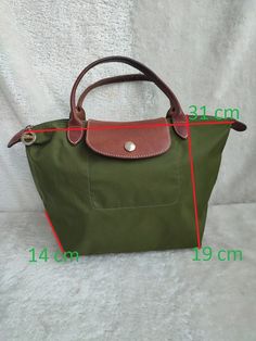 longchamp tote bag with small handles,green color, size 31cm*19cm*14cm, nylon material, good condition, there are slight scuffs on the corners see the latest photos, inside the bag is clean,without smell women's bag Green Satchel Bag With Rolled Handles, Green Shoulder Bag With Rolled Handles For Travel, Green Shoulder Bag With Rolled Handles For Everyday Use, Green Bag With Rolled Handles For Daily Use, Green Travel Bags With Rolled Handles, Green Tote Shoulder Bag With Rolled Handles, Green Shoulder Bag With Handle Drop For Travel, Longchamp Bag Outfit, Long Champ Bag