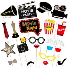 a bunch of party photo props on a stick with the words movie night written in it