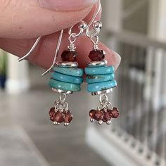 These adorable turquoise earrings feature natural turquoise disks topped with a faceted garnet rondelle. A cluster of small garnets dangle at the bottom. Accent beads, ear wires and headpins are sterling silver.  Total length: 1.5 inch One turquoise disk alone: 9 x 2.5mm Your jewelry will arrive in a cotton lined kraft box within a padded postal envelope. I use USPS first class mail. This usually takes 3 to 5 days to ship. International orders outside of the U.S. will take 8 to 15 days to ship. Hypoallergenic Turquoise Beaded Dangle Earrings, Turquoise Sterling Silver Beaded Dangle Earrings, Turquoise Metal Beaded Dangle Earrings, Turquoise Dangle Earrings With Silver Beads, Turquoise Silver Beads Drop Earrings, Copper Jewelry Diy, Diy Jewelry Projects, Beaded Earrings Diy, Button Jewelry