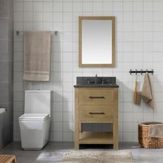 a bathroom with a toilet, sink and mirror in it's corner area next to a towel rack