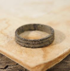 Antique brass or bronze primitive ring.  Found underground in amateur archaeology with a metal detector. Size - 4.5 or 15 mm. Height - 4 mm. Please visit my over stores on Etsy: https://www.etsy.com/shop/G7Elephants Vintage items. https://www.etsy.com/shop/GiftsFromPast Jewelry and watches. Primitive Wedding, Ring Spacer, Small Watch, Old Rings, Wedding Ring Sizes, Bronze Ring, Metal Detector, Brass Ring, Antique Rings