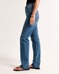 Step back into the '90s with the Abercrombie & Fitch Women's Ultra High Rise Straight Jeans, a perfect blend of vintage charm and modern comfort. These jeans are designed to flatter with an ultra high rise of 11.5 inches and a sleek straight leg that eases through the thigh, offering a structured yet relaxed fit. 

- Size: 34 LONG
- Color: Medium Wash
- Material: Body - Cotton, Elastane; Pocket Lining - Polyester, Cotton
- Gender: Female
- Age Group: Adult

Crafted from vintage stretch fabric, t 90s Straight Jeans, High Rise Straight Jeans, Women's Bottoms, Models Off Duty, Blue Denim Jeans, Model Photos, High Rise Jeans, Dark Denim, 90s Fashion