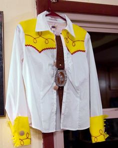 a white shirt with yellow and red details on it