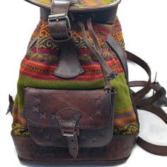 Handmade Leather Backpack Designed Specifically For Women. Made With Care In The High Andean Regions, This Versatile Piece Perfectly Combines Tradition With Functionality. This Backpack Is Handmade By Peruvian Artisans In Cusco. Measure 13 Inches Artisan Shoulder Bag With Leather Lining For Travel, Artisan Shoulder Bag For Travel With Leather Lining, Artisan Travel Shoulder Bag With Leather Lining, Casual Handmade Leather Bag, Handmade Leather Casual Bag, Artisan Travel Bag With Leather Lining, Leather Strap Travel Backpack, Bohemian Leather Bags With Leather Trim, Green Leather Shoulder Backpack