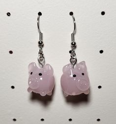 A cute pair of earrings made using pig shaped beads! -Each earring is made using nickel free earring wires that are 100% iron -Each pair comes with 2 silicone earring backs Cute Adjustable Resin Earrings, Novelty Dangle Resin Earrings, Novelty Resin Earrings With Ear Wire, Novelty Resin Dangle Earrings, Novelty Hypoallergenic Resin Earrings, Cute Resin Earrings, Pig Earrings, Earring Wires, Nickel Free Earrings