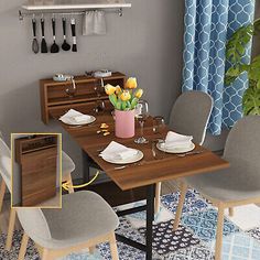 a dining room table with chairs and plates on it, next to a potted plant