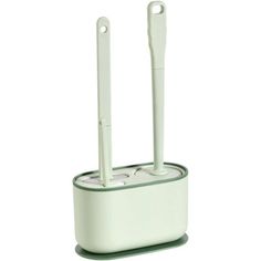 an electronic device with two toothbrushes in it on a white surface and one is plugged into the charger