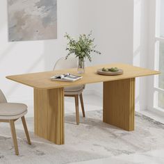 a wooden table with two chairs and a vase on it in front of a window