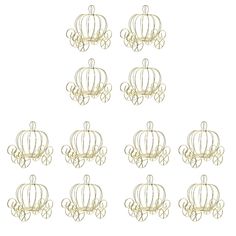 twelve gold wire crown ornaments with swirls on each one side and four in the middle