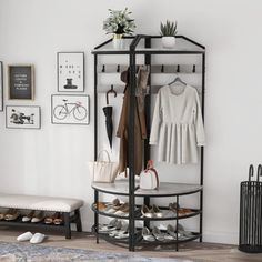 a black and white closet with shoes, purses and other items on it's shelves