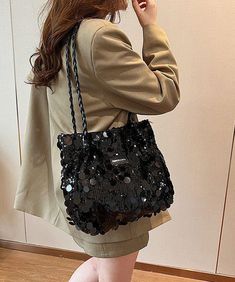 This exquisite satchel handbag boasts a generous capacity, adorned with silver sequins for a touch of sophistication.This bag is made of fine Polyester fabric.Measurement: 24cm/9.36" * 30cm/11.7" * 9cm/3.51"Zip up closure. Inside pockets. Large Capacity Double Handle Party Bag, Party Bags With Large Capacity And Double Handle, Glamorous Sequin Shoulder Bag, Chic Silver Bag With Sequins, Chic Sequined Shoulder Bag For Everyday Use, Party Bucket Shoulder Bag With Large Capacity, Large Capacity Bucket Shoulder Bag For Party, Party Large Capacity Bucket Shoulder Bag, Chic Sequin Bag For Everyday Use