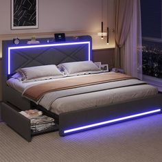 a bed with blue lights on the headboard and foot board is in a bedroom