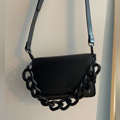 Na-Kd. Brand New. Worn Once. Perfect Condition. Modern Black Shoulder Bag With Chain, Black Square Bag With Chain Strap, Modern Black Shoulder Bag With Chain Strap, Black Crossbody Shoulder Bag With Chain Strap, Black Square Shoulder Bag With Chain Strap, Black Leather Bag With Gold Chain, Black Chain Link Bag, Black Satchel Shoulder Bag With Chain Detail, Black Rectangular Shoulder Bag With Chain