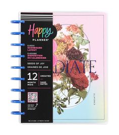 a spiral notebook with the words happy planner on it