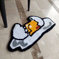 the rug is on the floor with an image of homer long - haired haircut