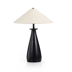 a black table lamp with a white shade on the top and bottom, in front of a white background