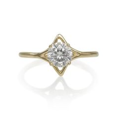 Stars and diamonds shimmer alike in this ring. A gold celestial halo illuminates your center stone, letting it shine just that much more. Makes for a fantastic engagement ring.  Features a 6mm (approx 1ct) Moissanite, round brilliant cut, colorless &  flawless. Also available with a diamond by request- please message for pricing & options. All rings are custom made to your desired size. Please allow 2-3 weeks for your order to be complete. Handmade in Northern California with sustainable Celestial 14k Gold Rings With Center Stone, Celestial Diamond White Diamond Ring, Celestial Style Diamond White Diamond Ring, Celestial Diamond Ring With Halo, Celestial Style Diamond Ring With Halo, Celestial 14k Gold Diamond Ring With Round Cut, Star Shaped Diamond Promise Ring, Celestial Yellow Gold Rings With Center Stone, Celestial Style Yellow Gold Rings With Center Stone