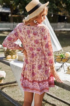 Our Rina Boho Dress comes in a blush base with tones of pink floral prints. It's a gorgeous lightweight material perfect for transitioning you to Spring. The peasant v neckline with tassel finishes is a gorgeous addition to this bohemian style. The short bishop sleeves are cinched with elastic on the cuffs making this practical and comfortable. The mini length is perfect for showing off your gorgeous legs! Size Guide: Fayette is 5’6” tall, and has a 33.45” bust, 26.5” waist, & 35.2” hips. She is Bohemian Dresses Short, Flowy Beach Dress, Prairie Dresses, Boho Fashion Summer, Holiday Flower, Holiday Events, Styl Boho, Ruffle Mini Dress, Flower Dress