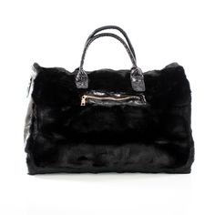 This spacious carrying bag features a fur and leather exterior and designer stylings that make it an impact making addition to any outfit and perfect for either casual or business outings. Product Dimensions (Inches): 21 x 13 x 11 Faux-Leather and Fur Exterior Polyester Lining Black Bags For Winter Errands, Luxury Shoulder Bag With Faux Fur Lining, Luxury Black Shoulder Bag For Winter, Luxury Faux Fur Shoulder Bag With Fur Lining, Luxury Faux Fur Shoulder Bag, Chic Winter Bags For On-the-go, Elegant Winter Shoulder Bag With Faux Fur Lining, Luxury Leather Shoulder Bag With Faux Fur Lining, Luxury Winter Shoulder Bag For Shopping