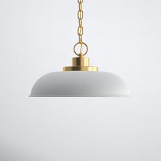 a white and gold pendant light hanging from a ceiling fixture with a chain attached to it