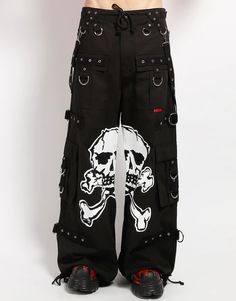 Accept no imitations! From the originator of all things DarkStreet, these black 'bad to the bones' pants feature removable straps, adjustable ankles, D-rings, and deep pockets with printed skull graphics inbetween the legs. WOMAN IS WEARING X-SMALLMAN IS WEARING MEDIUMSIZING BASED ON MENS FIT– Refer to Unisex Darkstreet Pant - Size Chart (Based on Men's Sizing)– Drawstring and adjustable waist buckles allow for a tighter fit on the waist– 100% Cotton.– Hand wash cold. Lay flat to dry. Emo Pants Men, Cargo Pants With Chain, Skull Pant, Trip Pants, Skull Outfit, Emo Pants, Scene Pants, Scene Clothing, Vampire Freaks