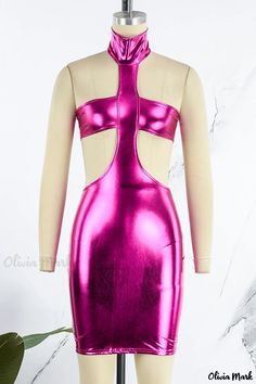 a mannequin wearing a pink dress with cut outs