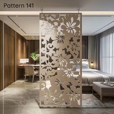 a room divider that has flowers cut out on it and sits in front of a bed