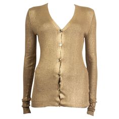 100% authentic Stella McCartney metallic ribbed cardigan in gold cotton (100%). Opens with six golden buttons on the front. Unlined. Has been worn and is in excellent condition. Measurements Tag Size 40 Size S Shoulder Width 35cm (13.7in) Bust 72cm (28.1in) to 106cm (41.3in) Waist 56cm (21.8in) to 104cm (40.6in) Hips 70cm (27.3in) to 112cm (43.7in) Length 66cm (25.7in) Sleeve Length 69cm (26.9in) All our listings include only the listed item unless otherwise specified in the description above. Cardigan Brown, Brown Cardigan, Vintage Cardigan, Ribbed Cardigan, Golden Brown, Cardigan Jacket, Metallic Gold, Cardigan Sweater, Stella Mccartney