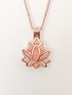 Beautiful Lotus Flower necklace with Rose Quartz tucked inside.  Gold. 18"+2 chain. Or Rose Gold (Zinc alloy) Rose Quartz Healing Properties ♥ Unconditional love ♥ Self-love ♥ Mother love ♥ Caring ♥ Kindness ♥ Friendship ♥ Romantic love ♥ Platonic love Check out all of our other items while you are here! Personalized Jewelry - Necklaces, bracelets, key chains, charms & more! Welcome to Real Cool Treasures where you will find high quality personalized jewelry, Floating lockets, and much more, all Rose Gold Pendant Locket Necklace With Adjustable Chain, Adjustable Pink Necklace With Rose Design, Pink Flower Pendant Jewelry With Rose Design, Adjustable Rose Gold Pendant Charm Necklaces, Adjustable Rose Gold Pendant Charm Necklace, Rose Gold Flower Pendant Charm Necklace For Valentine's Day, Rose Gold Flower Necklace As A Gift, Rose Gold Flower Shaped Jewelry With Adjustable Chain, Rose Gold Flower-shaped Jewelry With Adjustable Chain