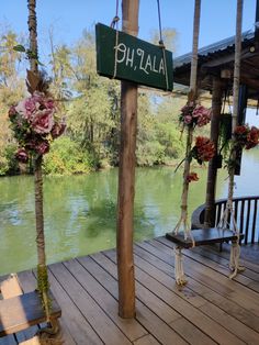 there is a sign that says phalli on the side of a wooden deck