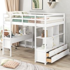 a white bunk bed with desk underneath it