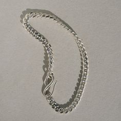 Inspired by the Roman “Good Goddess” Bona Dea, who was associated with serpents and snake-charming. A dependable curb chain bracelet. DETAILS hand cast snake clasp in sterling silver 4.3 mm sterling silver curb chain Choose 6.5 or 7 inches Minimalist Snake Chain Bracelet With Lobster Clasp, Sterling Silver Chain Link Charm Bracelet With Lobster Clasp, Silver Curb Chain Jewelry For Everyday, Silver Everyday Curb Chain Jewelry, Everyday Silver Curb Chain Bracelets, Everyday Silver Curb Chain Jewelry, Classic Sterling Silver Curb Chain Bracelet For Everyday, Everyday Sterling Silver Curb Chain Jewelry, Silver Curb Chain Bracelet With Oval Link