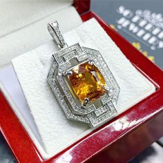 HUGE! Custom designed, DOUBLE HALO, Art Deco STYLE, YELLOW SAPPHIRE & Sparkling diamonds in handcrafted 18K solid white gold pendant! So sparkling in person! We are confident that you will love it! Vivid yellow color, perfect sparkling and lustrous natural yellow sapphire, at 7.45 carats, that's just beyond rare! SURROUNDED BY 0.90 CARATS OF F/VS NATURAL, DIAMONDS, SET IN 18K SOLID WHITE GOLD! What you see is what you will get! One of a kind SUGGESTED RETAIL VALUE: $8,800 SAPPHIRE: Weight: 7 White Gold Diamond Cut Citrine Jewelry, Fine Jewelry White Gold Citrine, White Gold Citrine Jewelry With Halo Setting, Citrine Jewelry With Halo Setting For Gift, Gia Certified Yellow Gold Pendant Jewelry, Gia Certified White Gold Pendant Jewelry, Gia Certified Platinum Jewelry In Gold Color, Gia Certified White Gold Pendant, Gia Certified Platinum Gold Jewelry