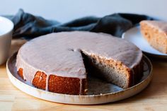 a cake on a plate with one slice cut out