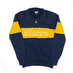 ELLESSE Sweatshirt Blue 1/4 Zip Womens XS Blue T-shirt For Winter Sports, Blue Branded Winter Sweatshirt, Winter Blue Branded Sweatshirt, Winter Blue Sweatshirt With Branding, Blue Sporty Sweatshirt With Branding, Blue T-shirt With Ribbed Cuffs For Streetwear, 90s Style Long Sleeve Blue T-shirt, 90s Blue Long Sleeve T-shirt, 90s Style Blue Long Sleeve T-shirt