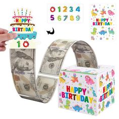 someone is holding up a birthday money box