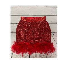 Very vibrant red sequin skirt trimmed with red feathers  **SIZE INCLUSIVE  Available in sizes XS - 3X   From waist to hem the skirt measures 18.5 inches long ( able to be lengthened by request for an additional fee)  Beautifully and professionally made from the inside out  PLEASE view size chart before placing your order Holiday Sequin Mini Skirt For Club, Feather Trim Mini Skirt For Party, Holiday Mini Skirt With Sequins For Club, Glamorous Party Skirt With Feather Trim, Glamorous Skirt With Feather Trim For Night Out, Red Mini Skirt For Costume Party, Party Fitted Skirt With Feather Trim, Glamorous Mini Skirt For Costume Party, Glamorous Feather Trim Bottoms For Night Out