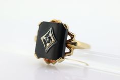 This is a super unique ring.  Excellent Pinkie ring. Onyx stone with a diamond center set. Condition: Shows minimal signs of wear. Has not been polished. Onyx has a tiny chip, barely visible. Details: 10k Yellow Gold Marked 10k 10mm by 12mm Rounded Rectangle 5mm rise 1mm diamond 2.6grams Size 6.5 Antique Black Rings With Rose Cut Diamonds, Luxury Onyx Diamond Ring For Formal Occasions, Elegant Onyx Diamond Ring For Formal Occasions, Formal Onyx Diamond Ring In Fine Jewelry Style, Formal Onyx Diamond Ring Fine Jewelry, Elegant Onyx Rings With Diamond Accents, Formal Onyx Diamond Ring With Gemstone, Anniversary Rings With Black Enamel And Diamond, Heirloom Black Enamel Rings For Wedding