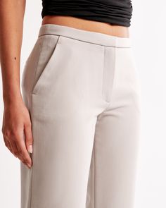 Elevate your wardrobe with the Abercrombie & Fitch Women's Low Rise Tailored Boot Pant in a sophisticated Ash color. These pants seamlessly blend comfort and style, making them a must-have for any fashion-forward wardrobe.

- Size: 34 REG
- Color: Ash
- Material: Polyester, Viscose, Elastane
- Gender: Female

Designed with a low rise and bootcut silhouette, these pants feature a slim waistband, functional pockets, and a smooth zipper closure. The tailored design and neutral hue ensure they pair Modern Fitted Straight Bottoms, Fitted Straight Work Pants For Spring, Sleek Pants With Pockets And Straight Hem, Spring Fitted Straight Work Pants, Modern Slim Fit Pants With Straight Hem, Fitted Pants With Seam Detailing And Straight Hem, Modern Straight Fit Bottoms With Straight Hem, Modern Slim Fit Bottoms With Straight Hem, Modern Straight Stretch Bottoms