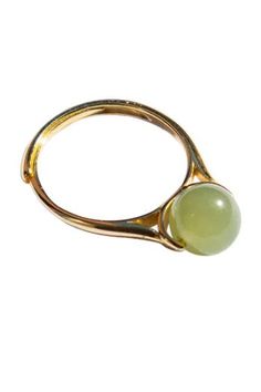 The Equinox ring features an adjustable gold-plated S925 silver gold band and a delicate nephrite bead.Natural and untreated nephrite. Made by handwork of carving and polishing. Because of the gemstone’s natural characteristics, each piece may vary slightly in colors and textures. Weight: 2g Band: Gold-plated S925 sterling silver, 1.5mm width, 1mm thick Bead: Nephrite diameter 7mm Modern Yellow Gold Jade Jewelry, Adjustable Elegant Jade Rings, Gold Jade Ring With Polished Finish, Adjustable Jade Ring, Modern Gold Jade Jewelry, White Rings, Jade Ring, Green Bead, White Ring