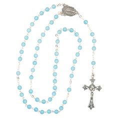 Give this beautiful blue aquamarine rosary to a loved one as a religious gift! Perfect for a baptism, First Communion or March birthday, this baby blue beaded rosary also makes a meaningful boy baby shower present. Take a look at even more religious keepsakes and gifts found elsewhere on this website. Metal. 18 3/4" Blue Rosary With 8mm Beads And Crucifix, Blue Rosary With 8mm Beads In Cross Shape, Blue Rosary With Round Beads For Gift, Blue Beaded Rosary As A Gift, Blue Cross Rosary For Gift, Blue Cross Rosary As Gift, Blue Spiritual Rosary As A Gift, Adjustable Blue Rosary With Miraculous Medal, Blue Rosary With 8mm Beads For Healing