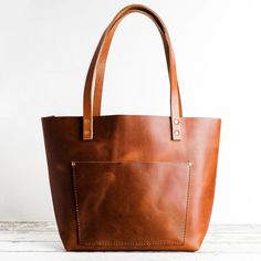 Our "Almost Perfect" Honey Classic Tote is handmade by artists in our shop in Portland Oregon. Made from the most durable leather that will last a lifetime Portland Leather Goods, English Bridle, Star Beauty, Everyday Purse, Buy Bags, Tan Cowhide, Oversized Tote, Leather Hide, Almost Perfect