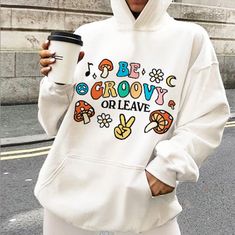 Groovy Oversized Sweatshirt, 80s Retro Womens Hoodie, Trendy Tiktok VSCO Pinterest Graphic Hoody, Cosy Hippie Hoody, Retro Quote Hoody Cute and Aesthetic Retro Hoodie resonating a classic vintage 80s charm with text that reads 'Be Groovy or leave' MADE TO ORDER ITEM - - FEATURES - - * Available in multiple colors, styles, and sizes  * 50% pre-shrunk cotton, 50% polyester * Medium Fabric (8.0 oz/yd (271.25 g/m)) * Front pouch pocket * Air-jet spun yarn with a soft feel and reduced pilling * Doubl Cartoon Print Hoodie For Streetwear In Fall, Fall Streetwear Hoodie With Cartoon Print, Fall Cartoon Print Hoodie For Streetwear, Oversized Hooded Sweatshirt With Cartoon Print, Leisure Hooded Hoodie For Fall, Oversized Cartoon Print Hoodie Sweatshirt, Oversized Winter Hoodie With Cartoon Print, Trendy Winter Hoodie With Cartoon Print, 90s Style Long Sleeve Hoodie For Fall